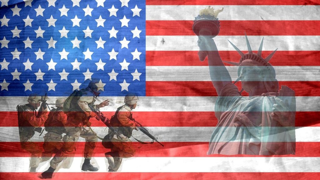 A proud, waving American flag stands tall beside soldiers in uniform, saluting in honor and unity. This image symbolizes the strength and sacrifice of veterans and the financial security offered by the San Diego Disabled Veterans' Property Tax Exemption.