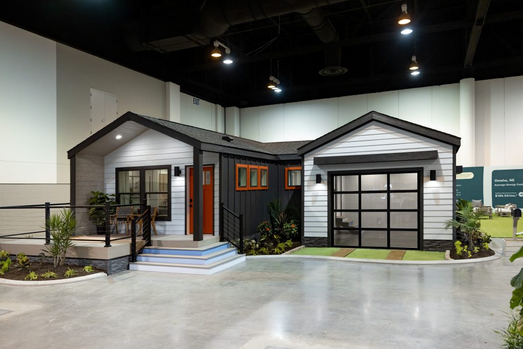 Open-plan interior of a modern manufactured home showing kitchen and living area